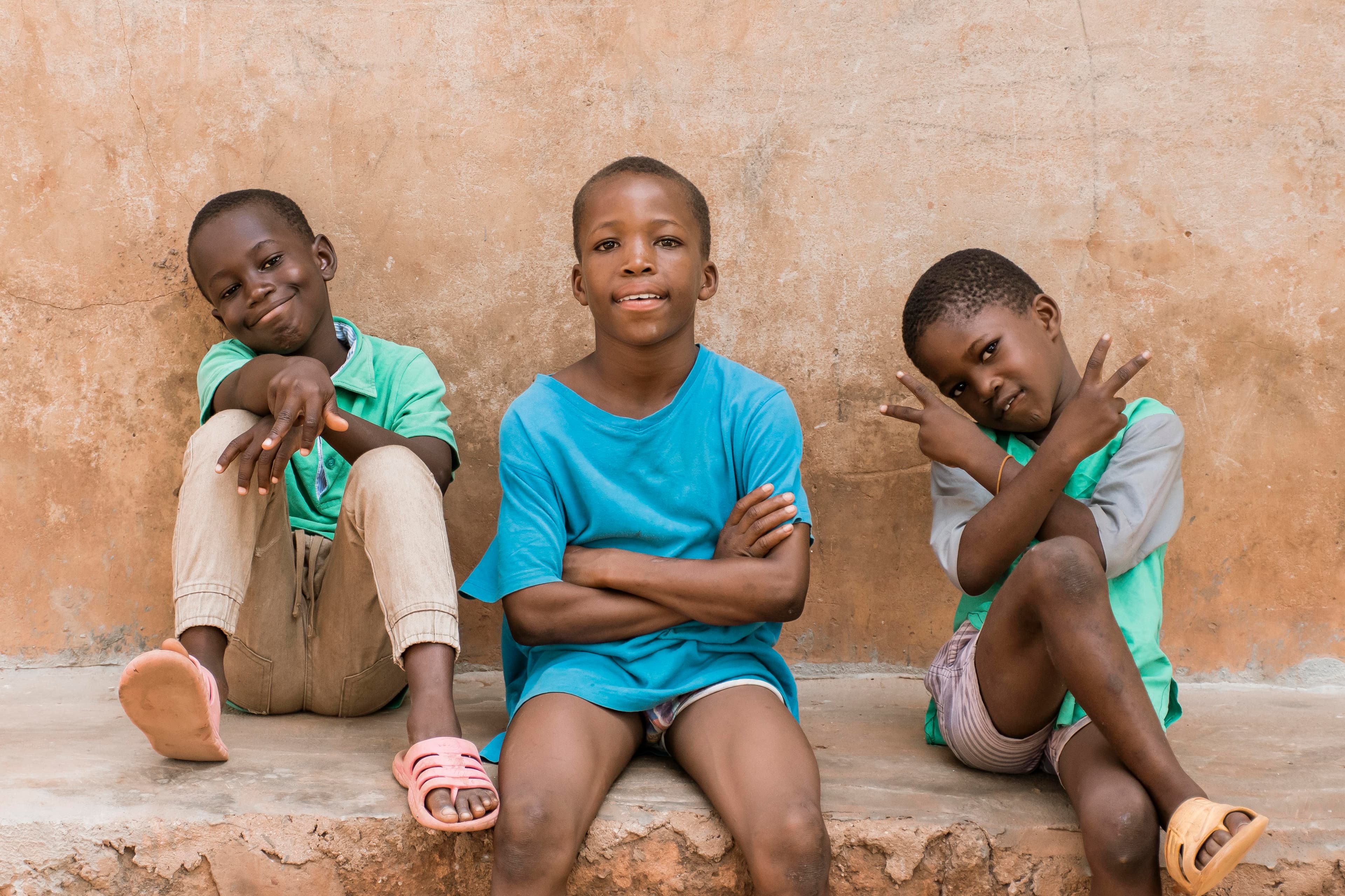 Children sitting together outdoors